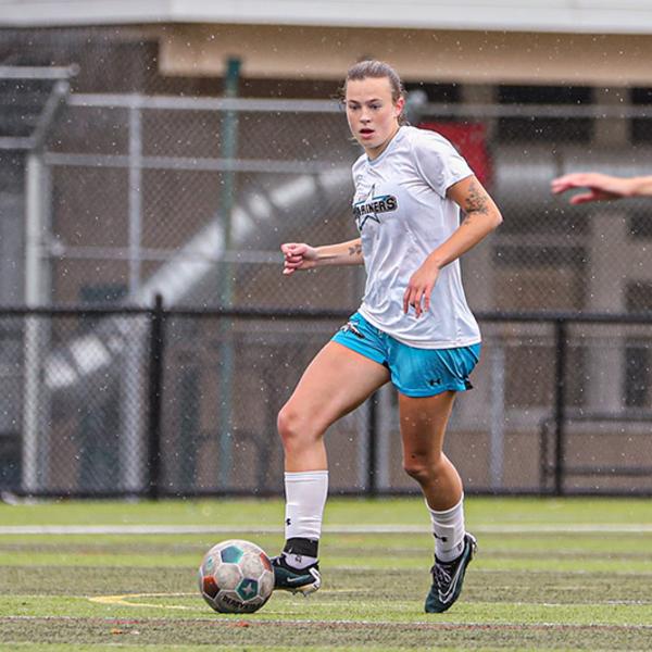 jade kicks the ball