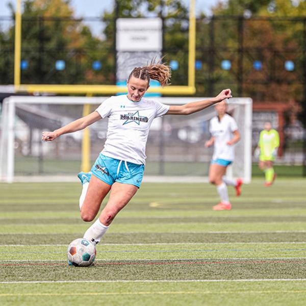 mya kicks the ball