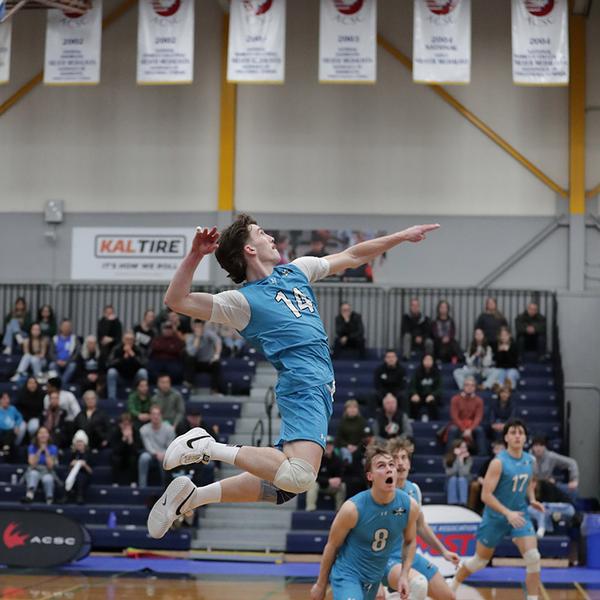 rylan hits a serve