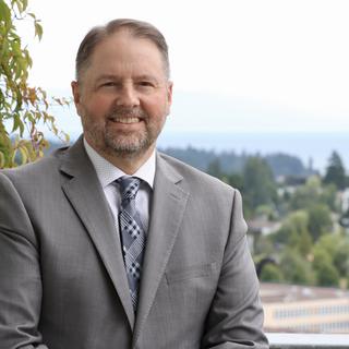 Dennis Johnson with a view of the City of Nanaimo behind him