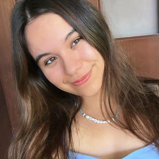 Meylin smiling at the camera