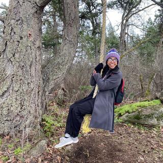 Becky sits in a tree swing