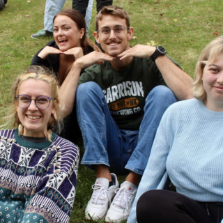 victoria dudley sitting outside with a group of her friends