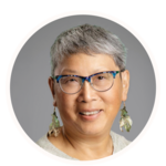 Smiling woman wearing glasses.