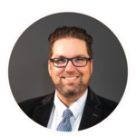 A smiling man in a suit. 