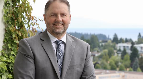 Dennis Johnson with a view of the City of Nanaimo behind him
