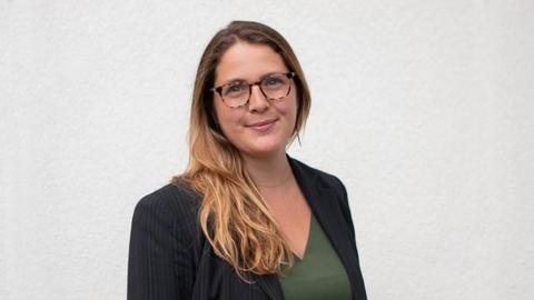 Amanda Wager against a white wall