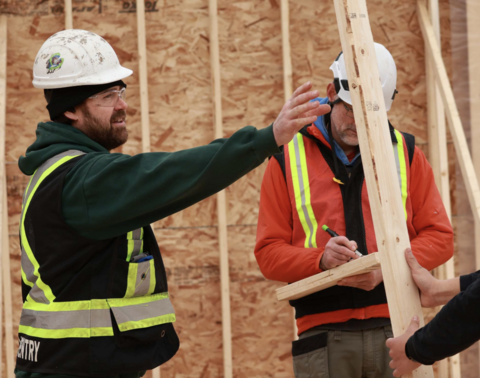 VIU carpentry students working on a housing comstruction site